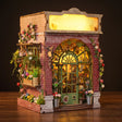 The Blossom House florist book nook on a dark walnut backdrop with warm glow