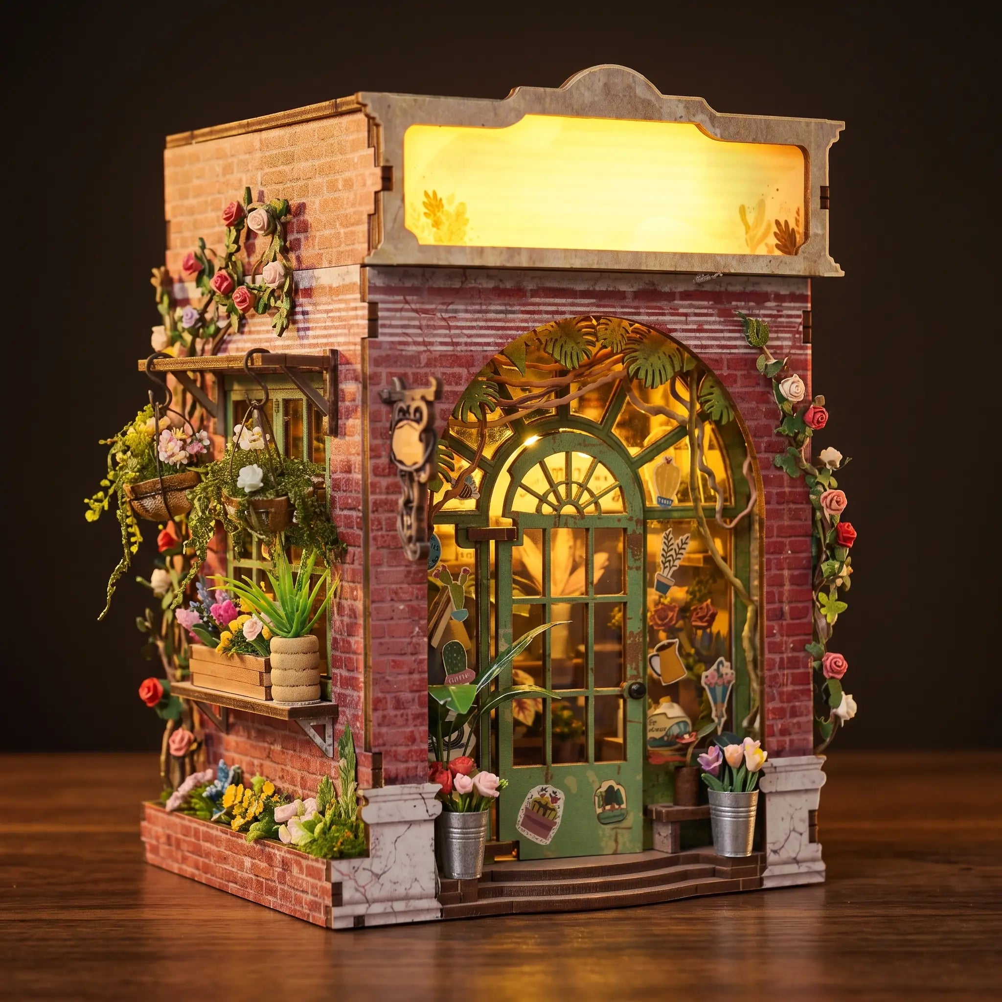 The Blossom House florist book nook on a dark walnut backdrop with warm glow