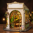 The Spring Conservatory DIY book nook kit, cream-stone greenhouse with a glass conservatory roof and glowing plants