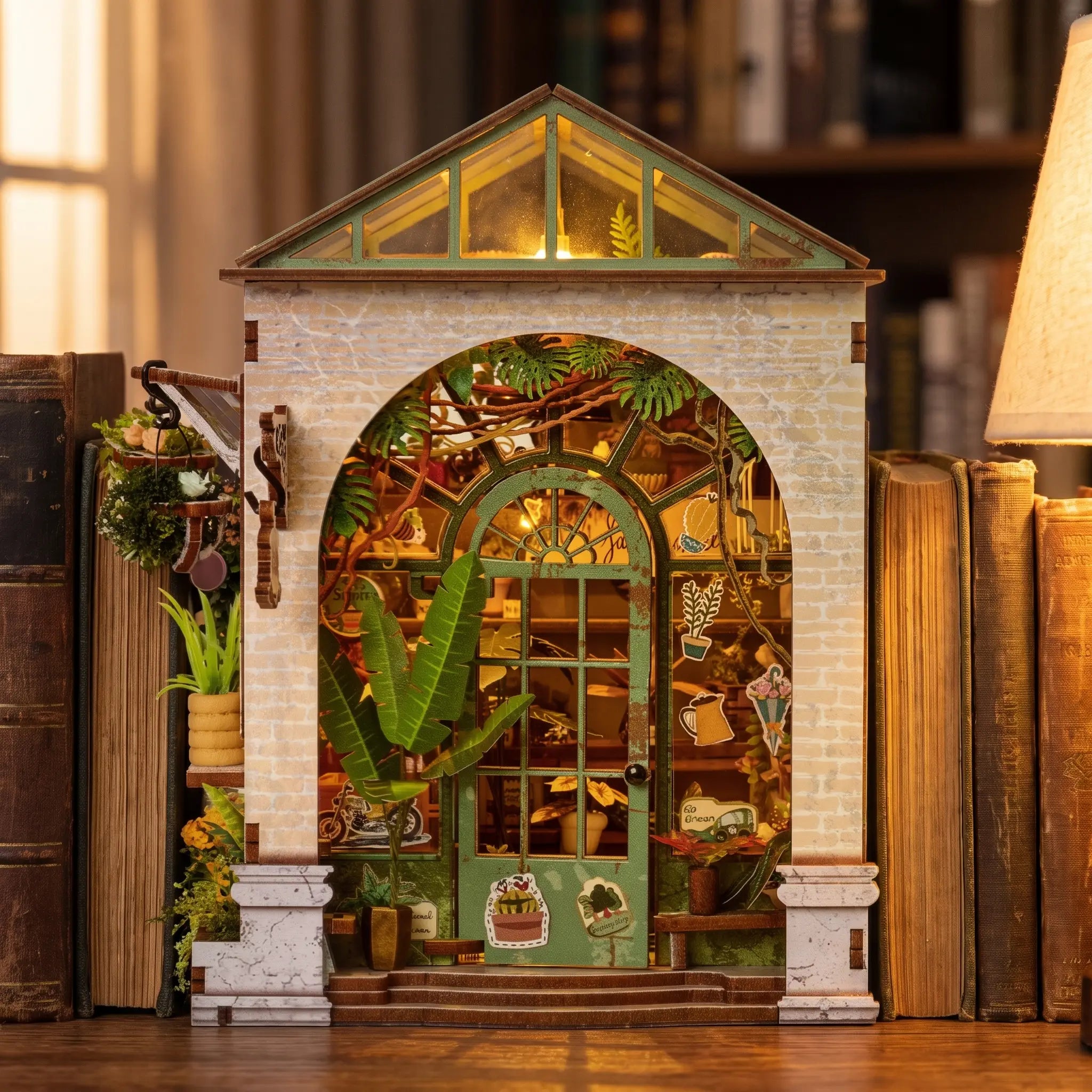 The Spring Conservatory book nook slotted on a bookshelf at dusk, warm interior glow