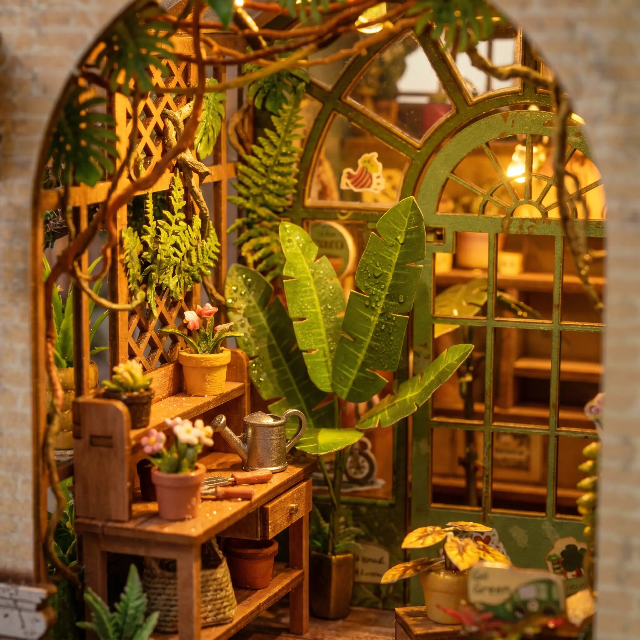 Close-up of the lit greenhouse interior with banana-leaf plants and flowering pots