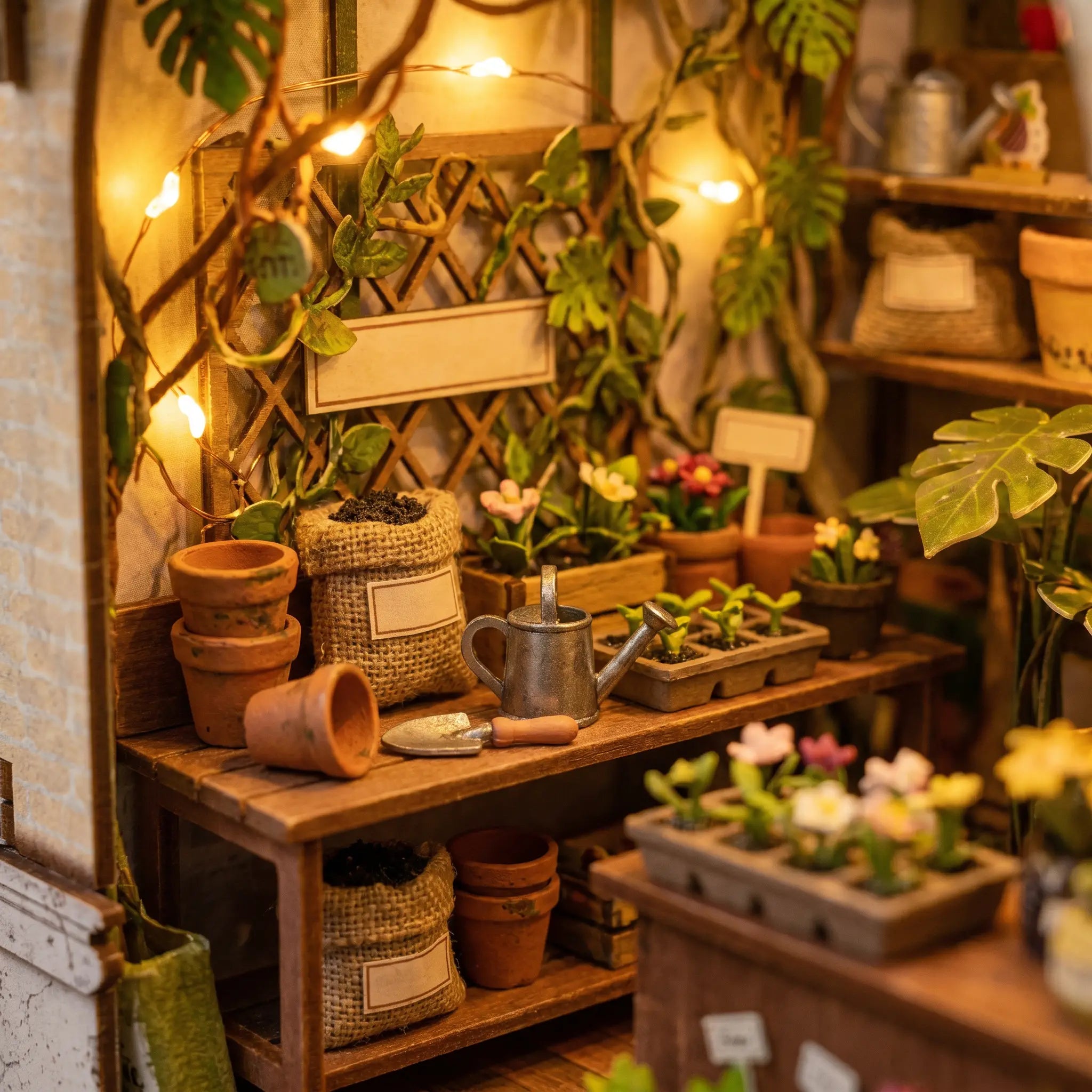 Close-up of the potting bench with terracotta pots, watering can and seed trays