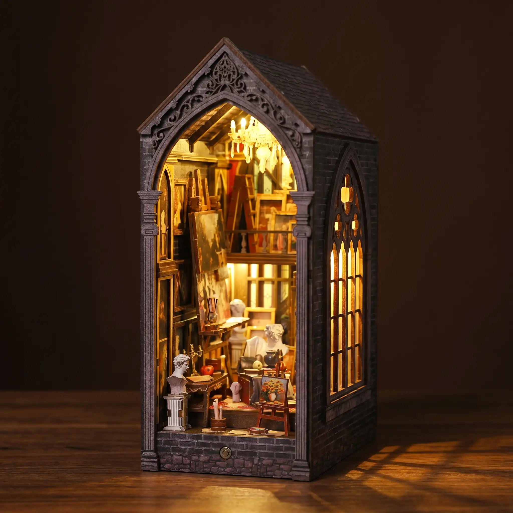 The Painter's Atelier gothic painting studio book nook on a dark walnut surface
