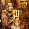 Close-up of art-supply shelves with canvases and brushes inside The Painter's Atelier