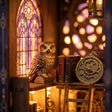 Macro of the perched owl inside The Arcane Tower book nook