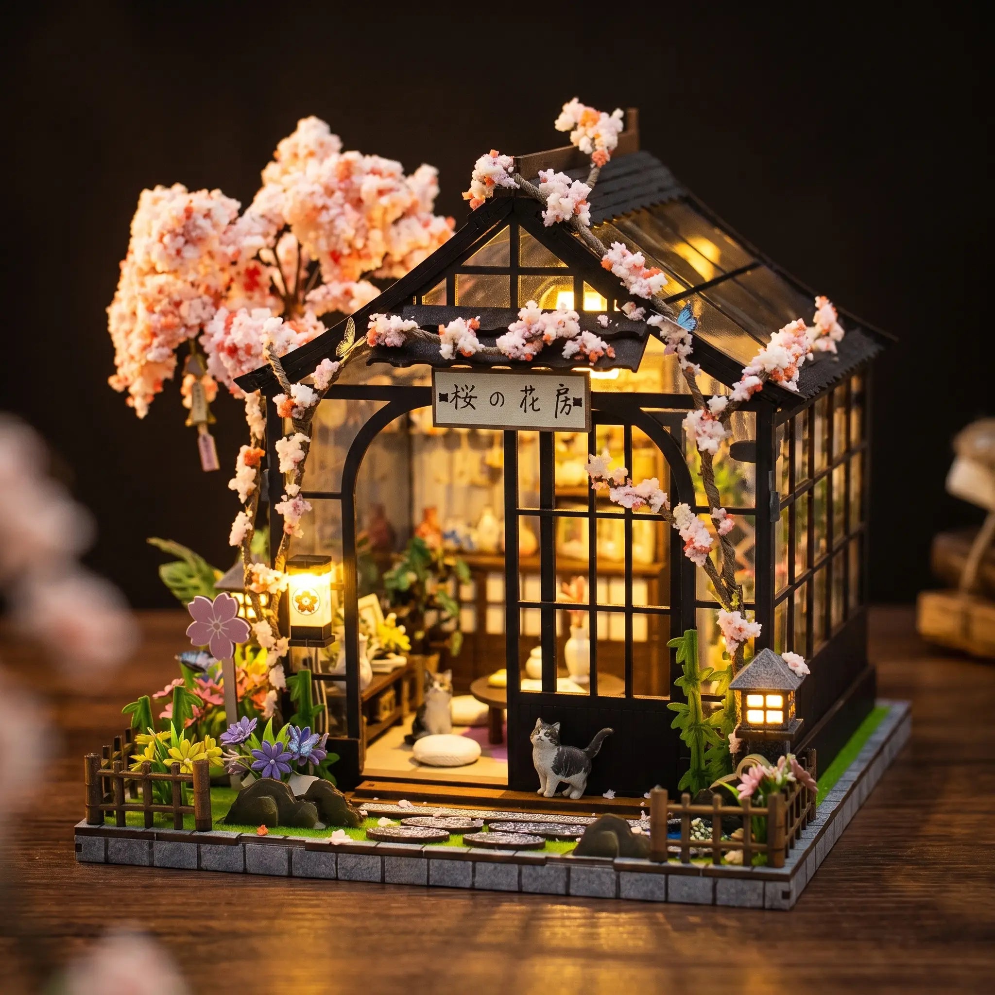 The Sakura Teahouse lit interior on a dark walnut backdrop