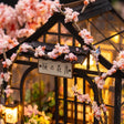 The Sakura Teahouse sign board and blossom gable detail