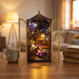 The Midnight Garden on a warm wood desk beside a mug of tea and books