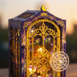 The Midnight Garden gold filigree door, moon charm and zodiac wheel detail