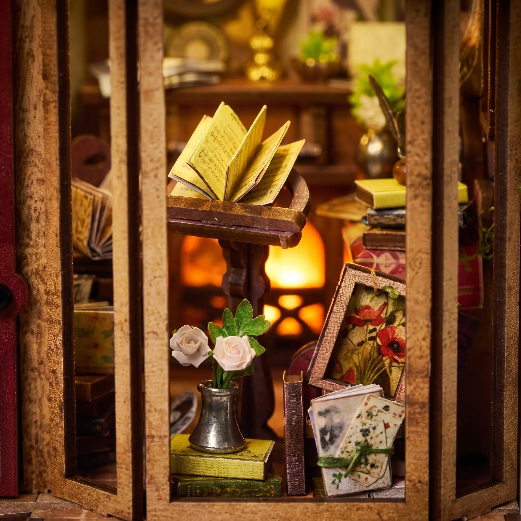 Close up of the bay display window with open songbook, white roses and stacked books