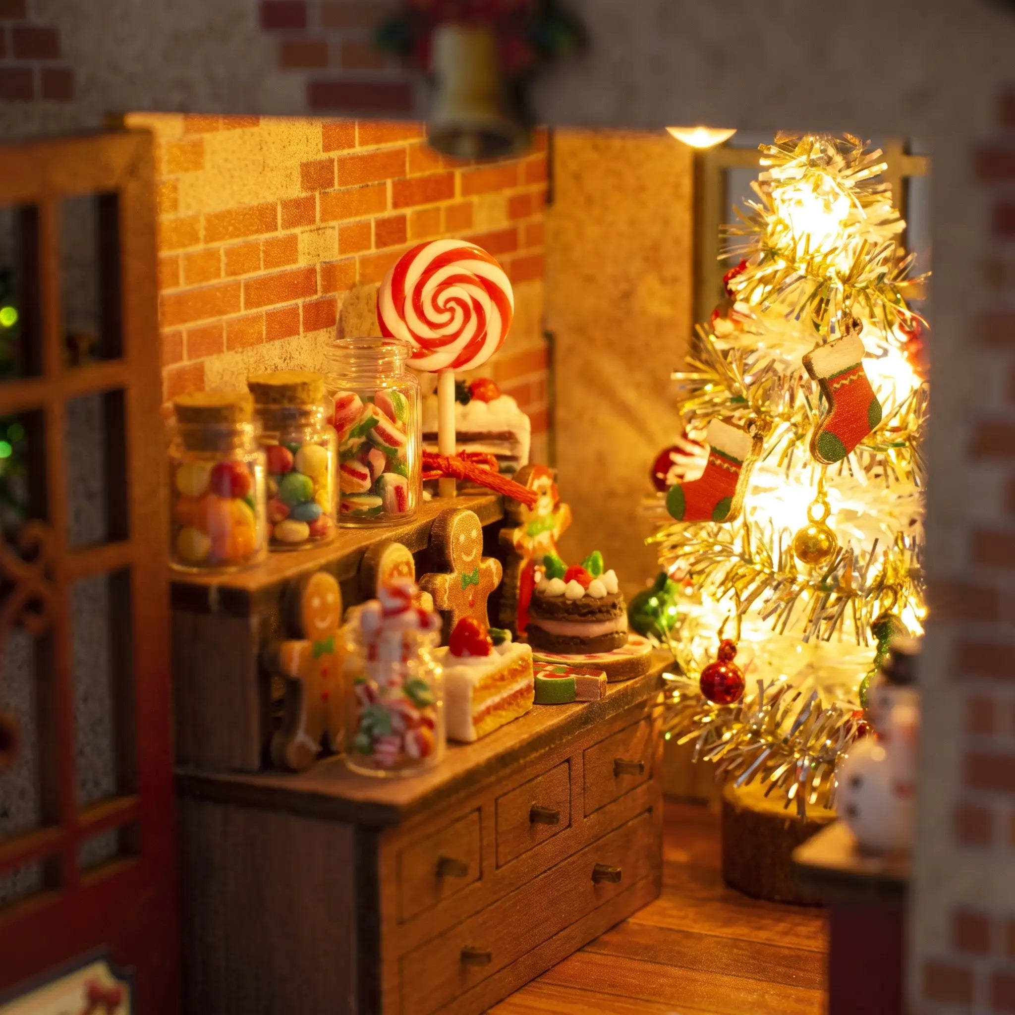 Candy counter detail inside The Candy Cane Cottage with gingerbread men and a swirl lollipop