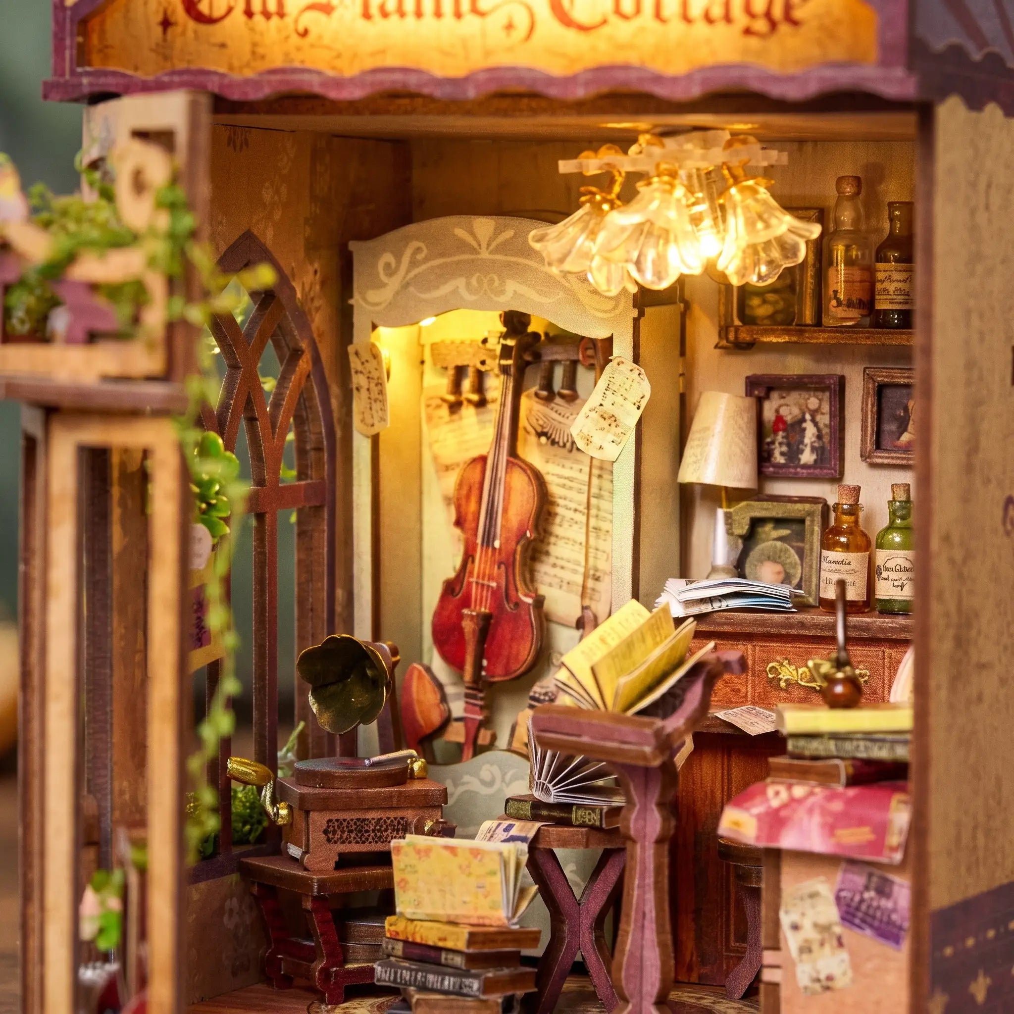 Close up of the violin, brass gramophone and flower chandelier inside The Serenade