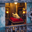 Close up of the dragon skull on a red velvet cushion inside the carriage