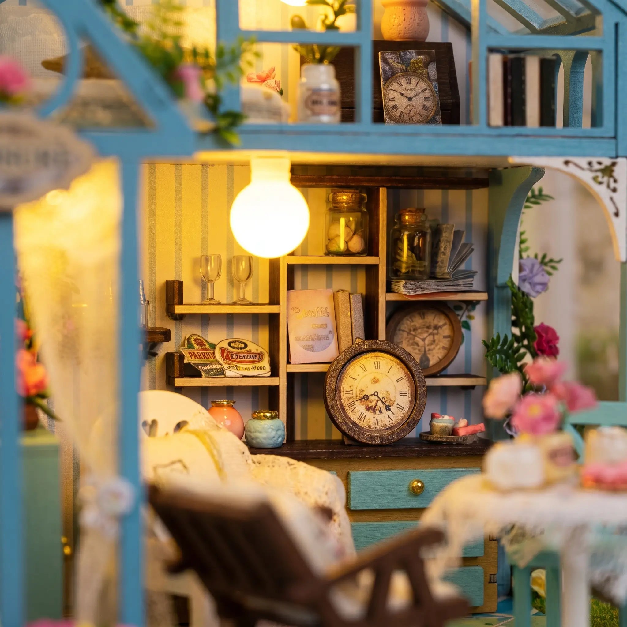 Close up of the shelf wall with vintage clocks and tiny jars