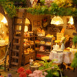 Close up of the ground floor bakery with cake shelves and coffee sign