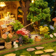 Close up of the garden pond with fishing rod and white rabbit