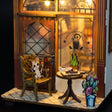 Cat on a chair by the cafe table detail of The Coffee House