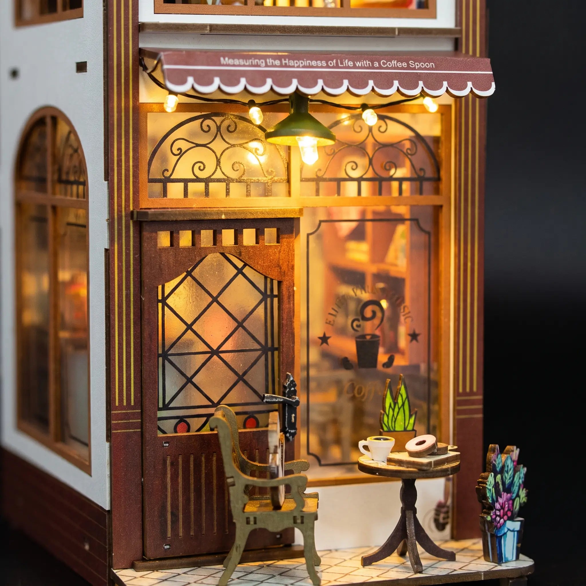 Stained glass door and green pendant lamp detail of The Coffee House
