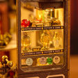Close up of the display window with gold potion bottles