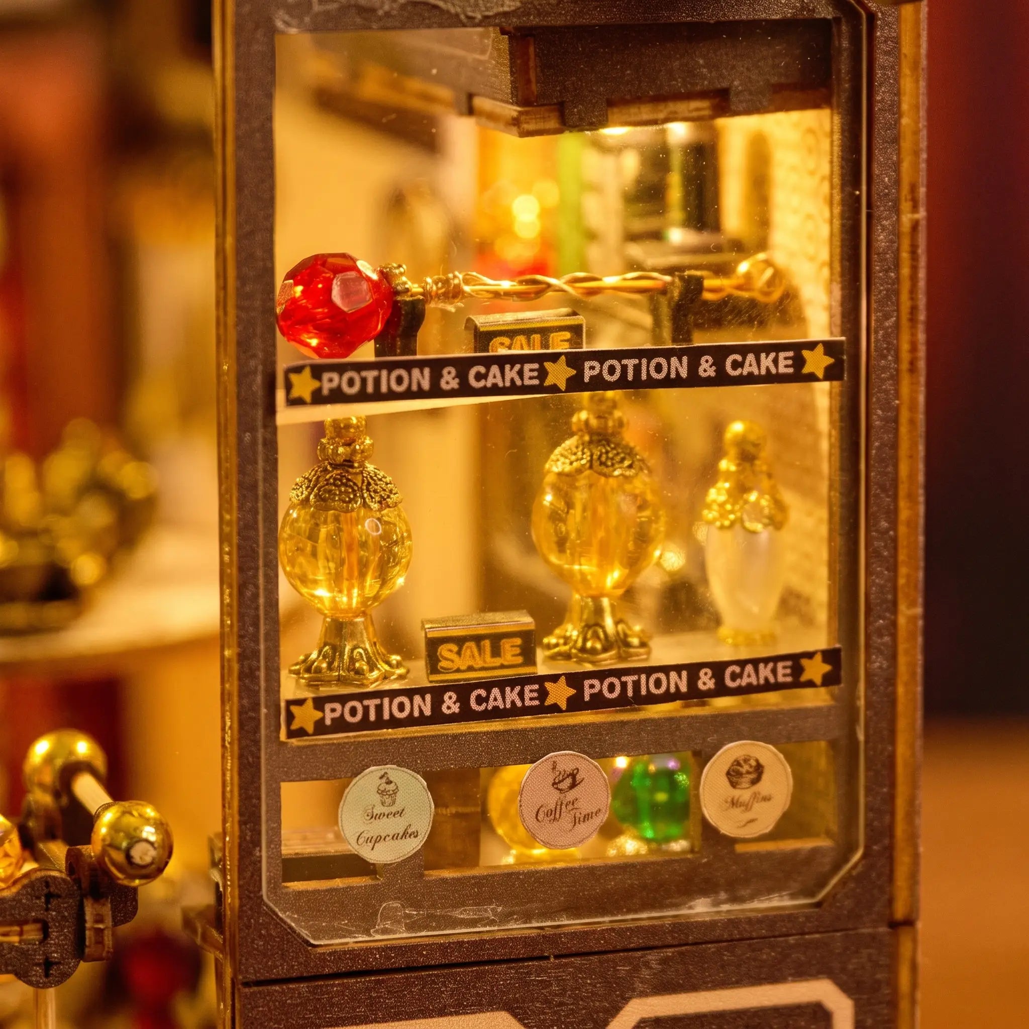 Close up of the display window with gold potion bottles