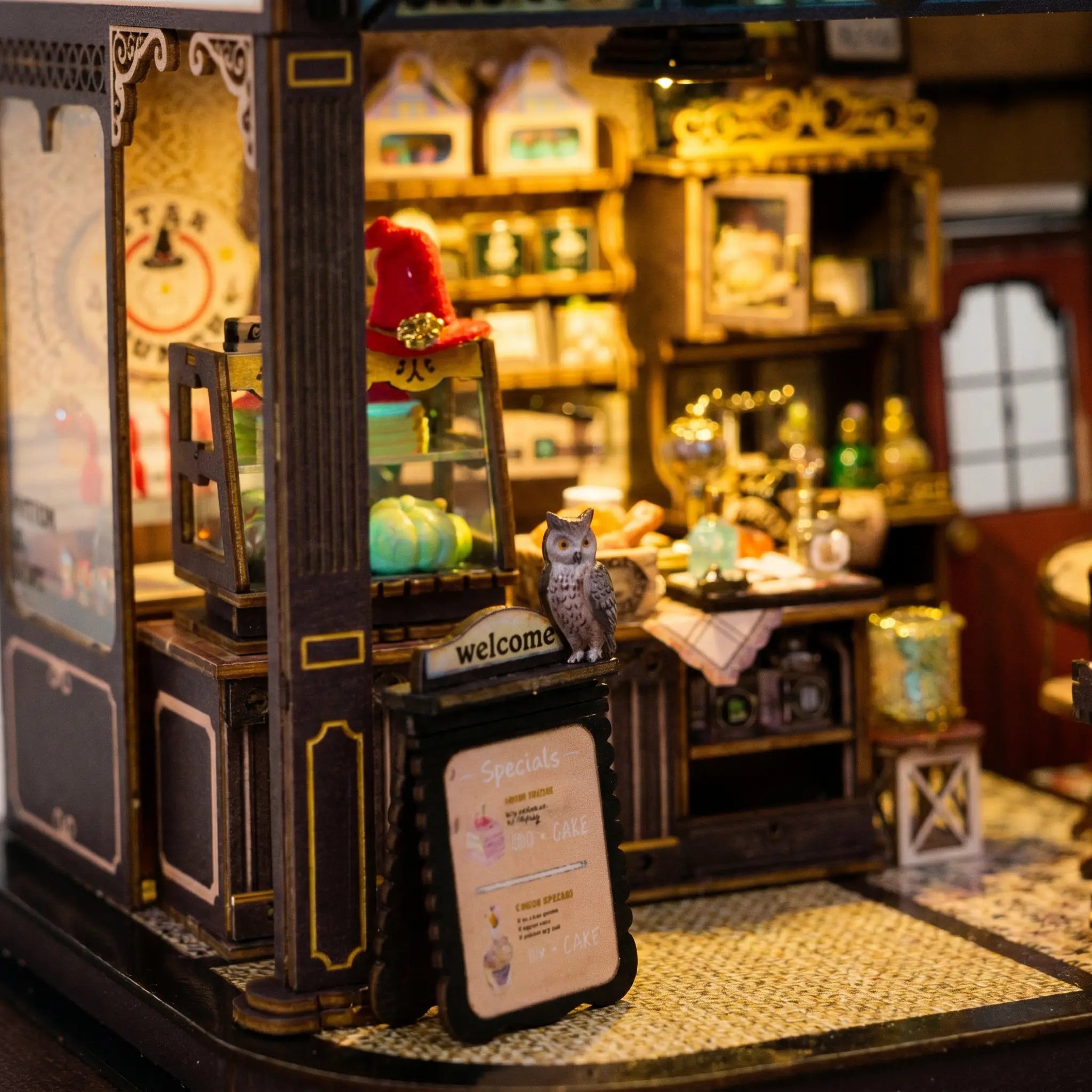 Close up of the counter with red hat, owl and menu board