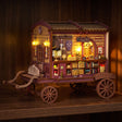 The Fortune Wagon glowing on a dark walnut shelf at night