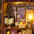 Sword shield and crystal ball detail of The Fortune Wagon