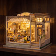 The Jewel Box glowing on a dark walnut shelf at night