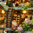 Close up of the ground floor bakery with cake cabinet and coffee sign under snow