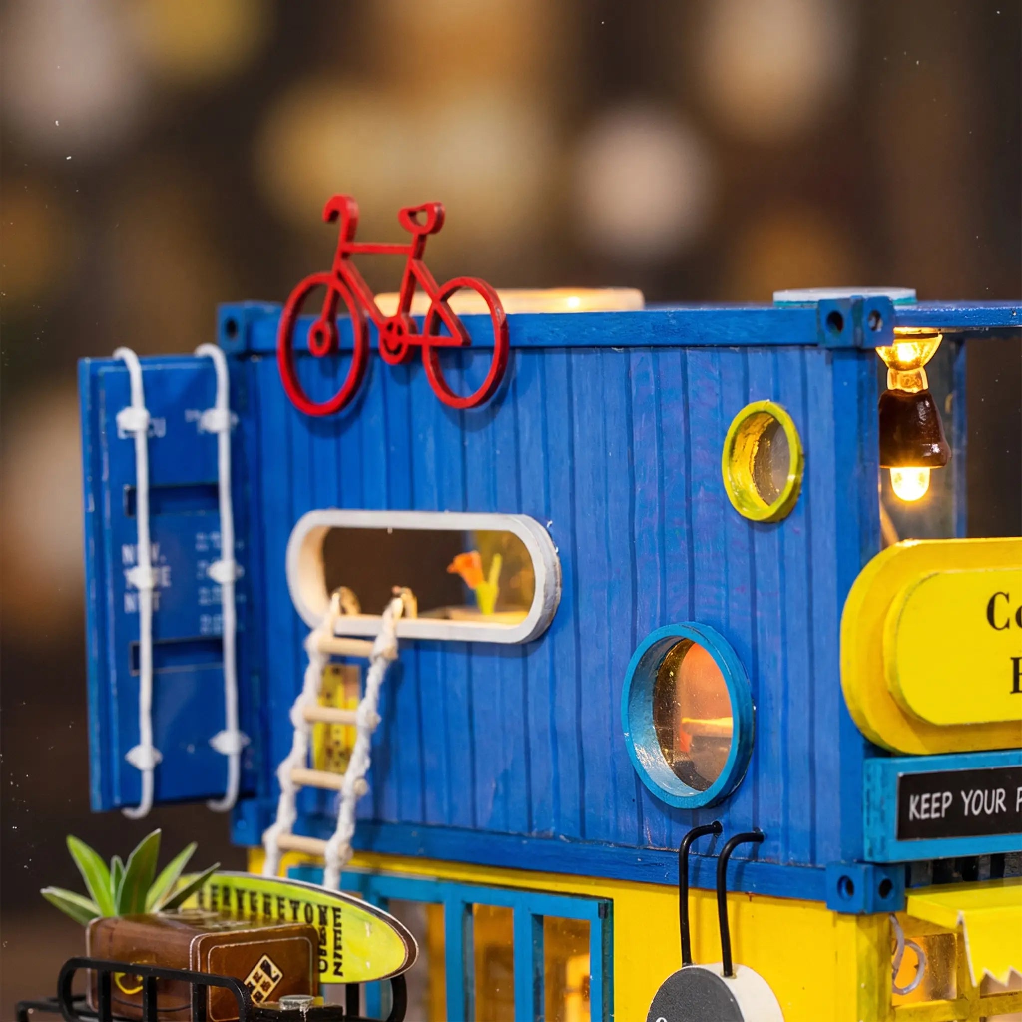 Close up of the red bicycle on the blue container roof of The Roadside Bistro
