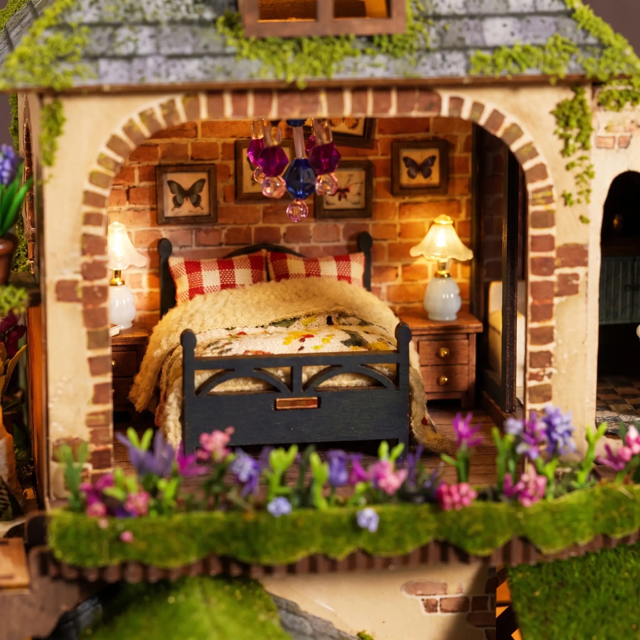 Close up of the brick-arched bedroom with navy bed and milk-glass lamps