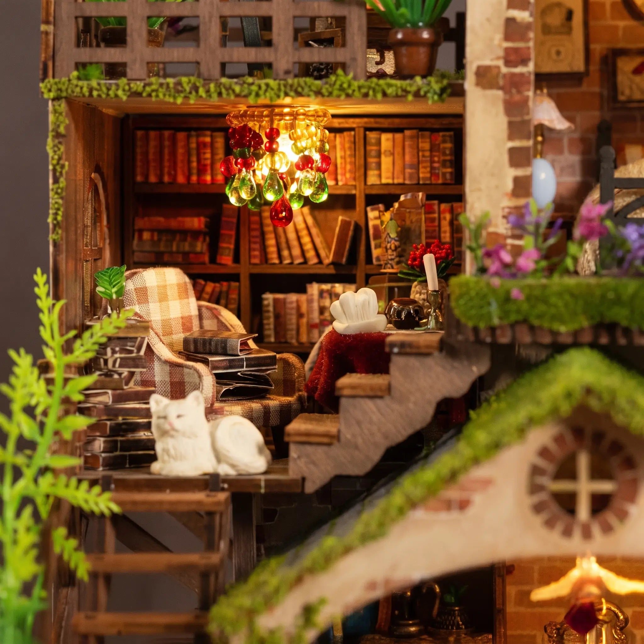 Close up of the library with beaded chandelier, plaid armchair and white cat