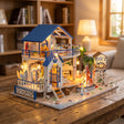 The Seaside Villa kit glowing on a table in a cozy living room at dusk