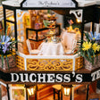 Close up of the lace tea table with silver teapot on the terrace of The Duchess's Tea Room