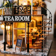 Close up of the spiral staircase and chalkboard menu easel of The Duchess's Tea Room