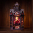 The Dragonspire lit book nook glowing on a dark walnut shelf
