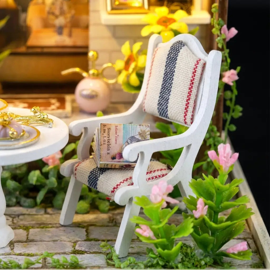 Detail of the striped garden chair with a tiny open storybook
