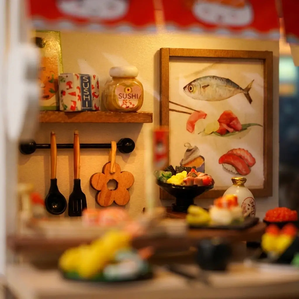 Detail of the back wall with hanging ladles and the framed sushi print
