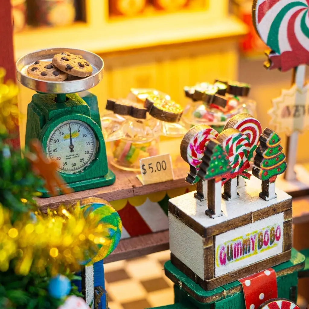 Detail of the candy counter: vintage scale, candy jars and lollipop stand