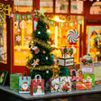 Detail of the tinsel-wrapped Christmas tree and gift bags