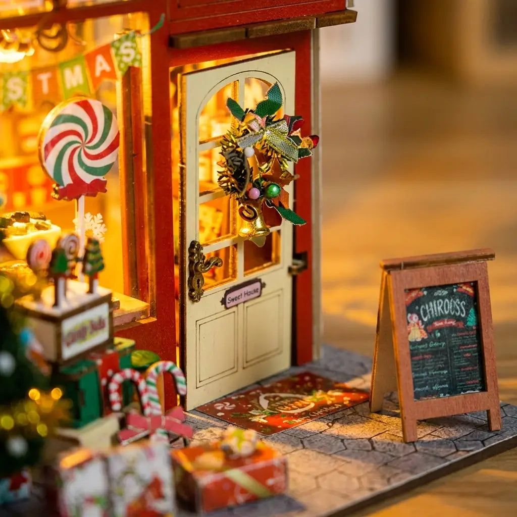 Detail of the arched door with wreath and the chalkboard menu