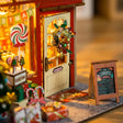 Detail of the arched door with wreath and the chalkboard menu