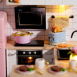 Macro detail of the cooking corner with polka-dot pot and blue toaster inside The Breakfast Bar kit
