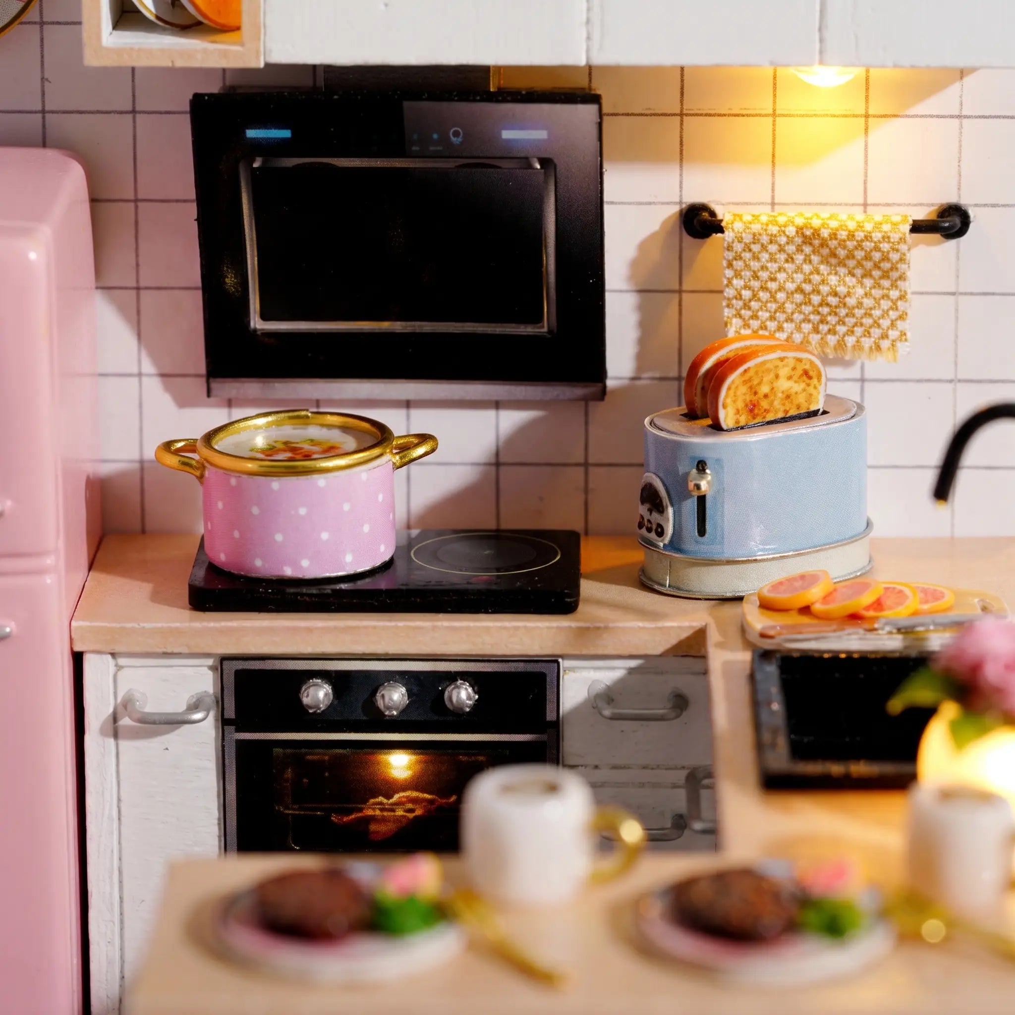 Macro detail of the cooking corner with polka-dot pot and blue toaster inside The Breakfast Bar kit