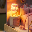 Macro detail of the glowing ruffled lamp and nightstand inside The Cottontail Room kit