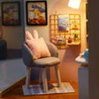 Macro detail of the tub chair with bunny-ear cushion inside The Daydream Desk kit