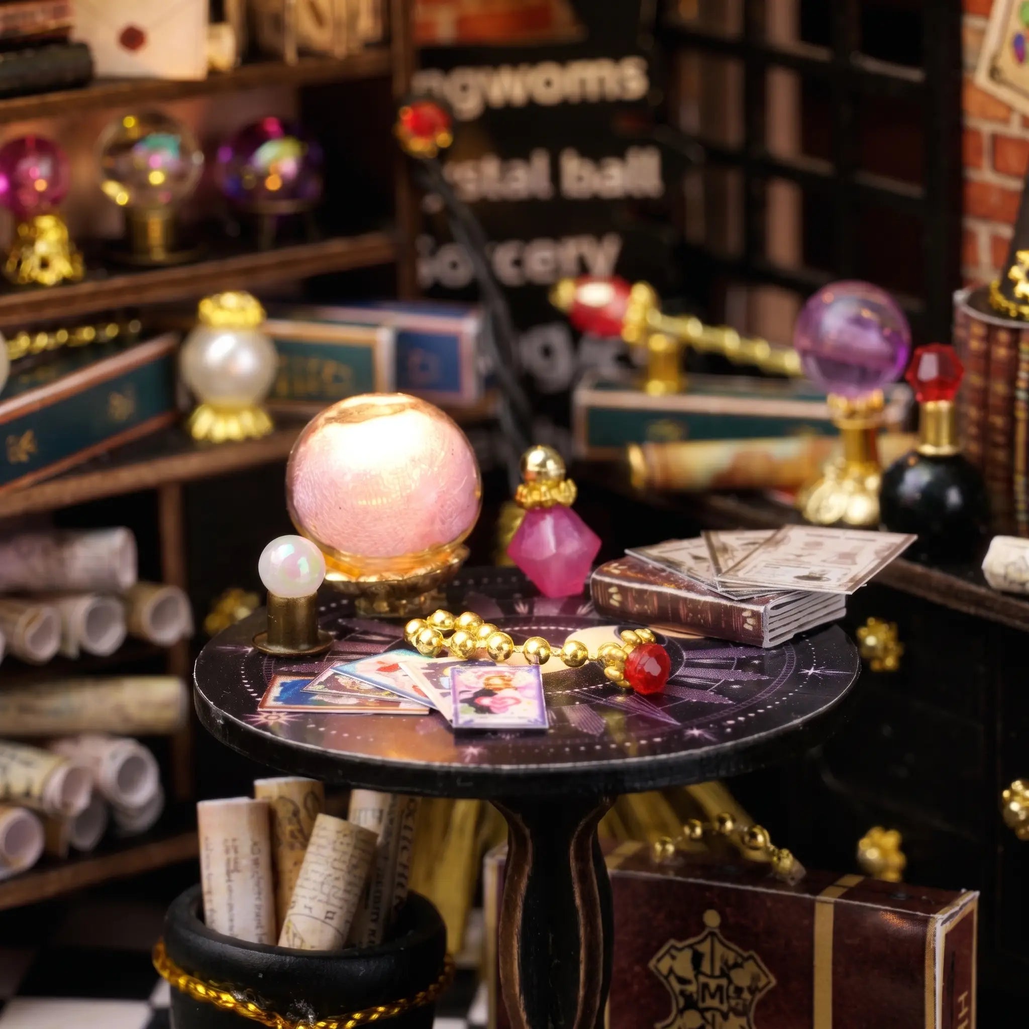 Macro detail of the glowing crystal ball and fanned tarot cards inside The Seer's Parlor kit