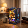 The Neon Reactor on a desk at dusk beside a mug of tea