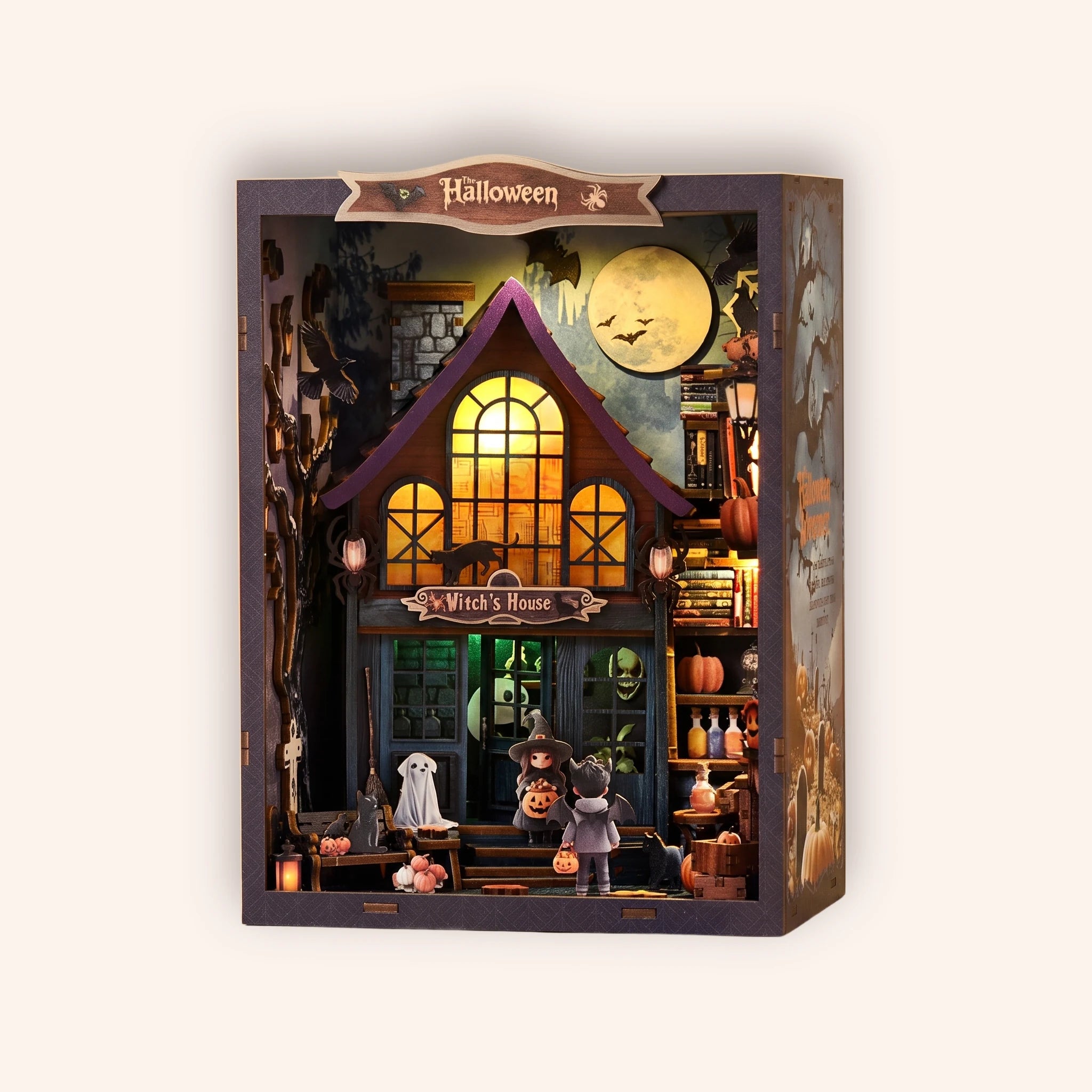 The Haunted Manor DIY book nook kit, spooky Halloween mansion glowing on a cream background