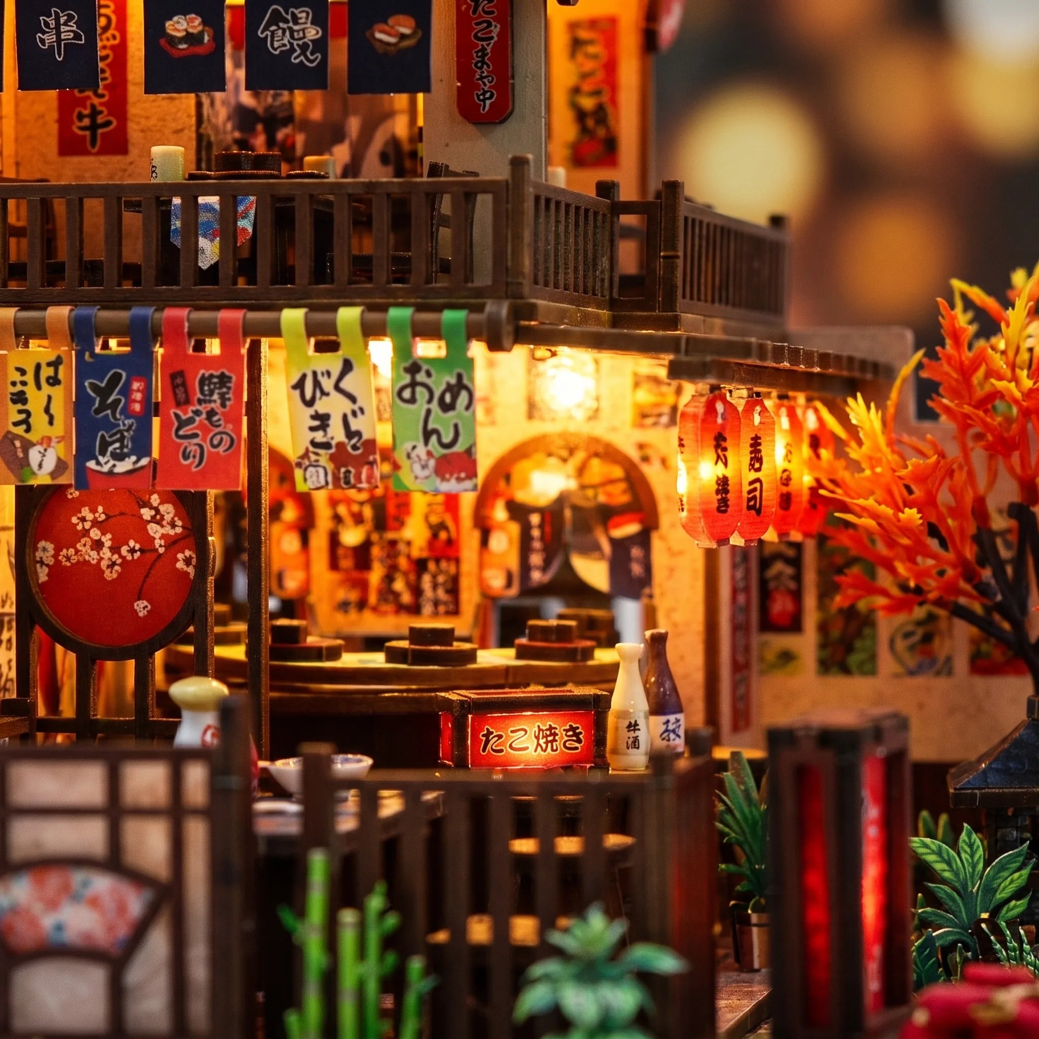 Close up of the lit teahouse counter and hanging lanterns